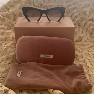 MIU MIU Black sunglasses Cat-eyed